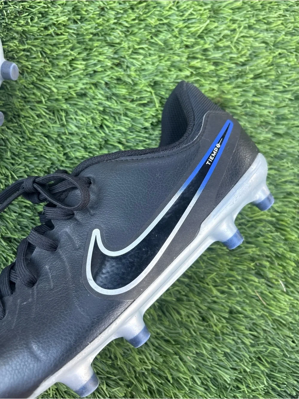 Nike Kids Black Soccer Cleats with Blue Accents